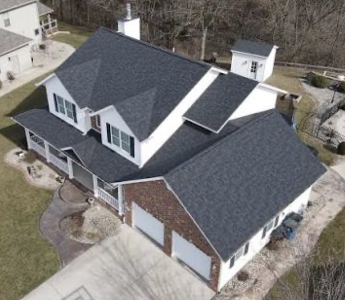 Two story home with new dark architectural shingles